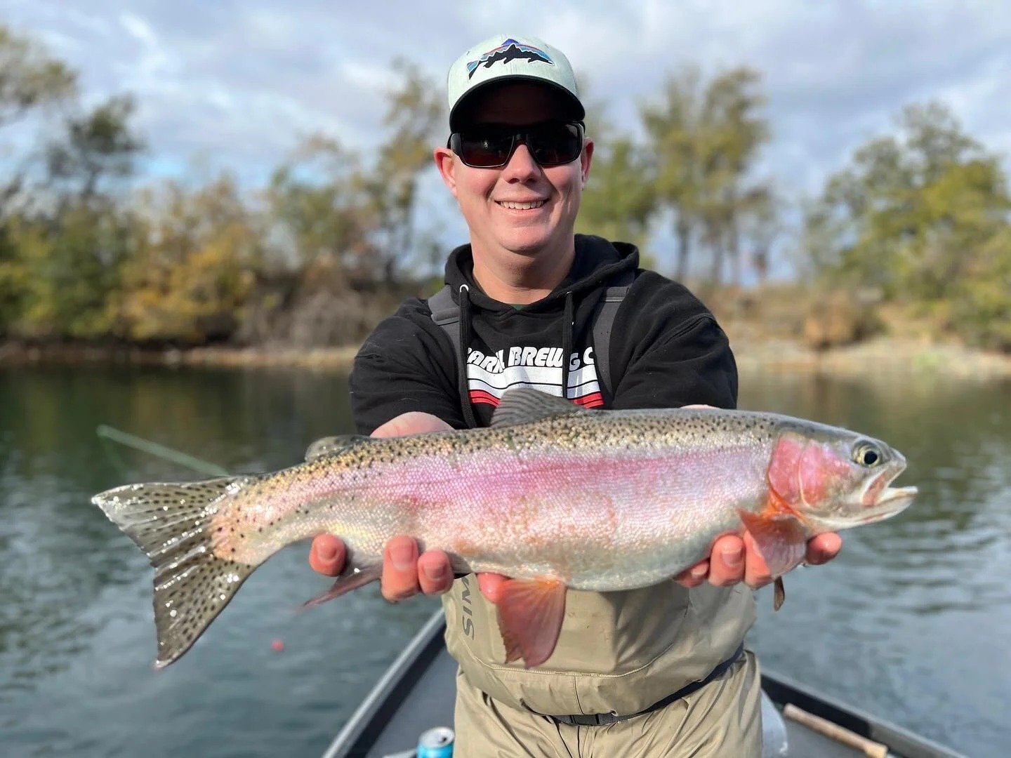 A guide working with a client on the water, photographed by Reel Adventures Guide Service in CA