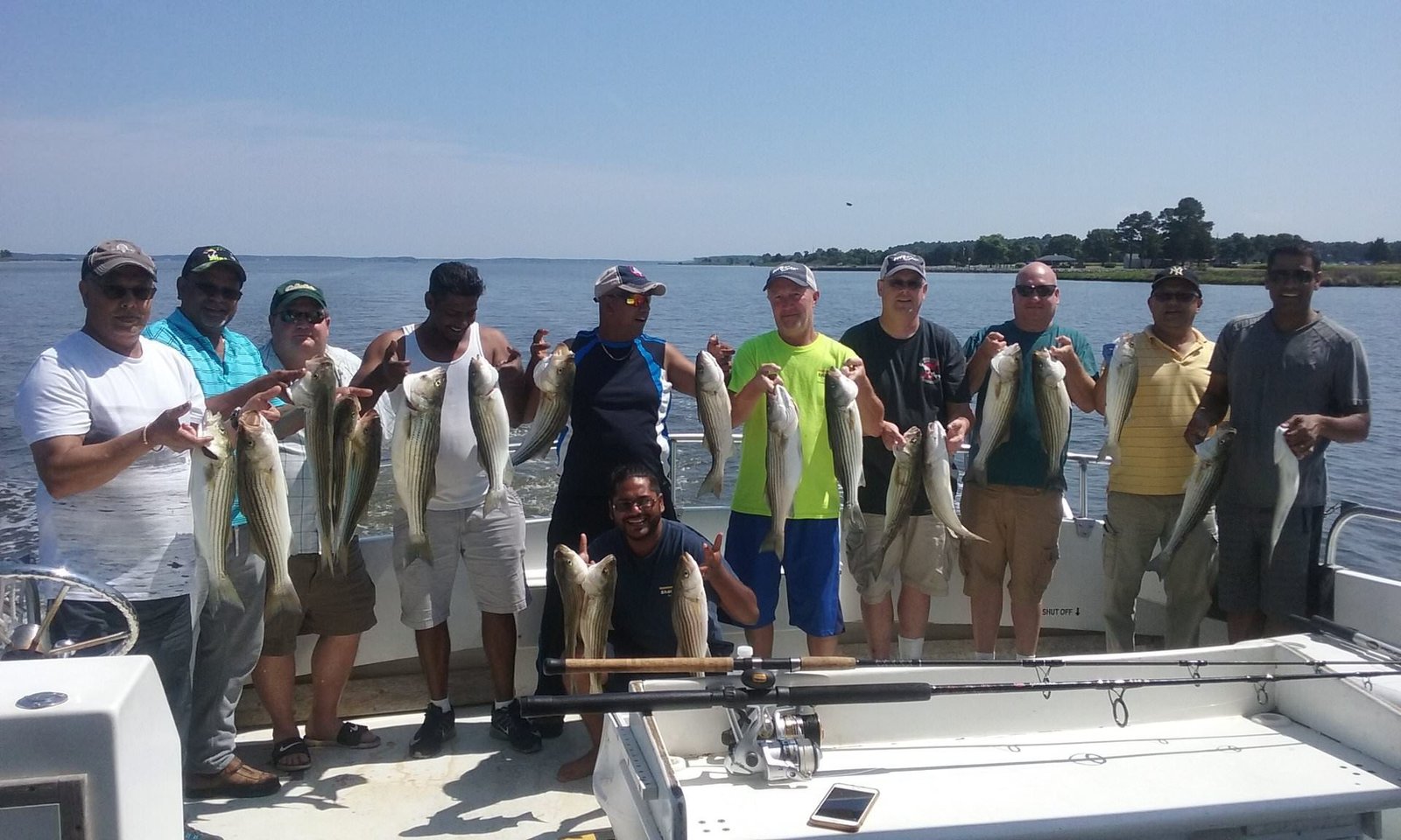 A guide working with a client on the water, photographed by Sawyer Charters in MD
