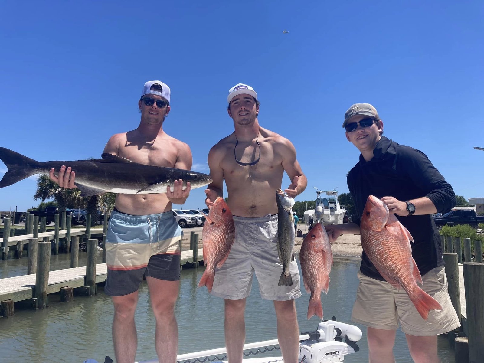 A guide working with a client on the water, photographed by Sea Dawg Charter in AL