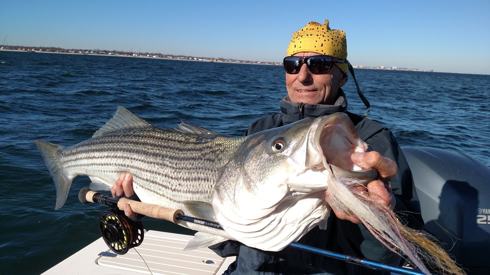 A working guide boat on open water, photographed by Shore Catch Guide Service in NJ
