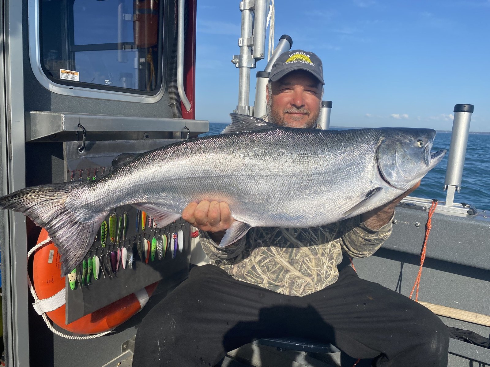 A guide working with a client on the water, photographed by Silver King Charters in NY
