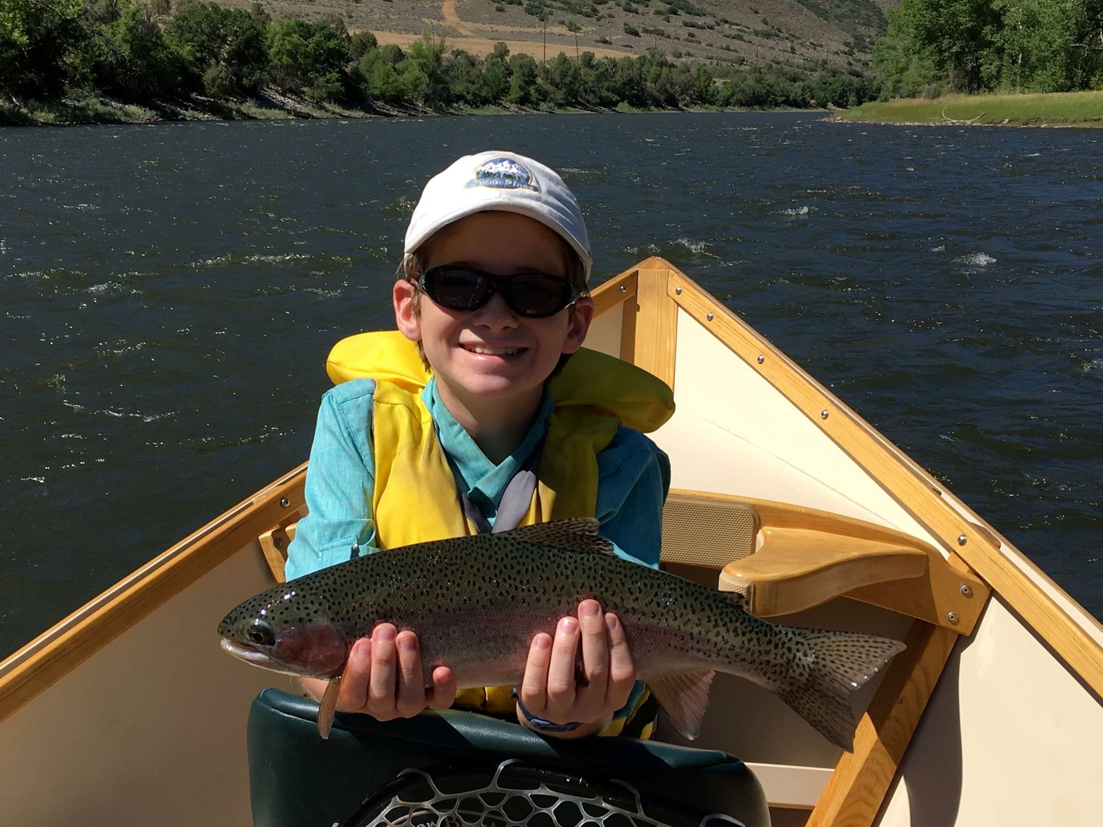 A guide at work during a trip, photographed by Sopris Fishing Outfitters in CO