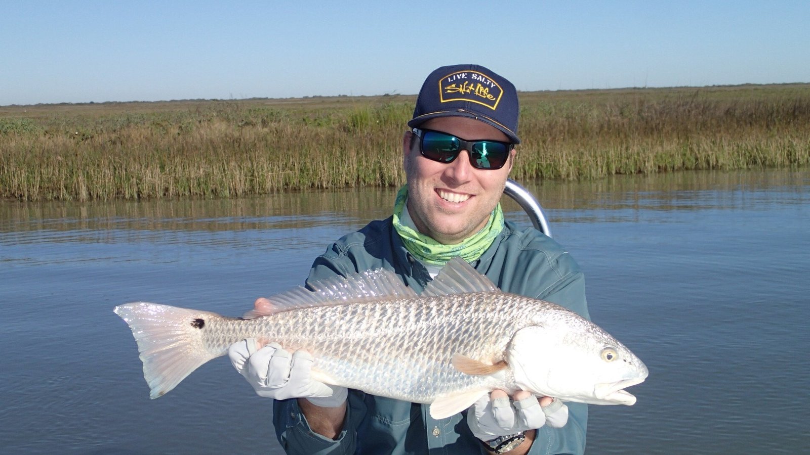 A guide working with a client on the water, photographed by South Texas Fly Fishing in TX
