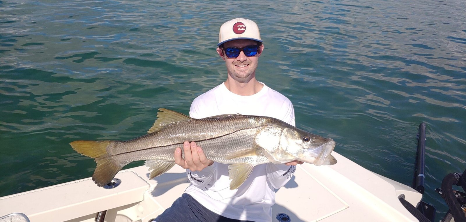A guide at work during a trip, photographed by St Lucie Flats Fishing in FL