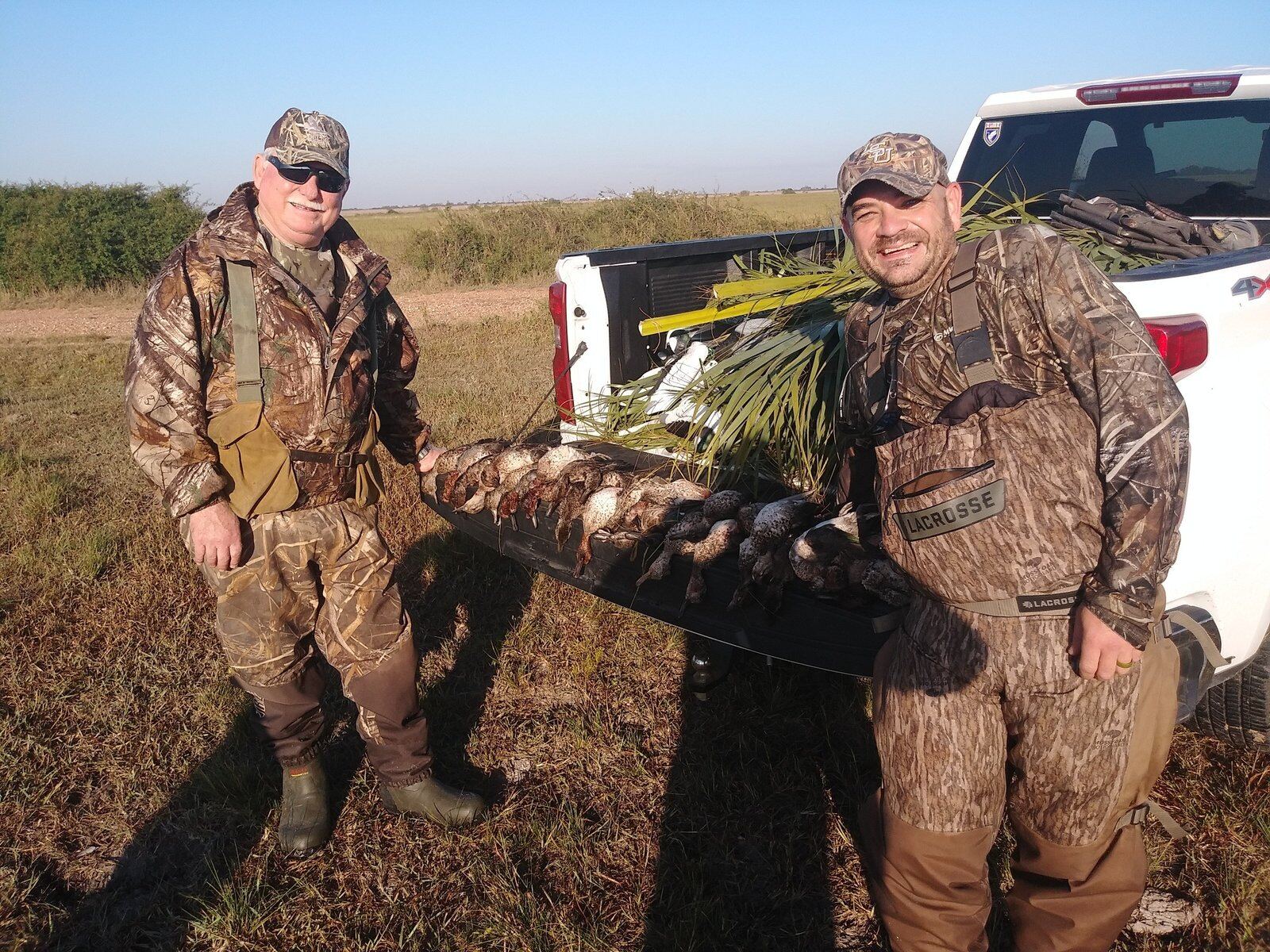 A guide working with a client on the water, photographed by Texas Coastal Adventures in TX