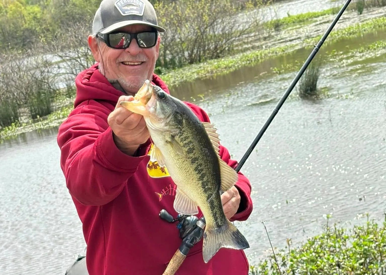 A guide working with a client on the water, photographed by Texas Fishing Frenzy Guide Service in TX