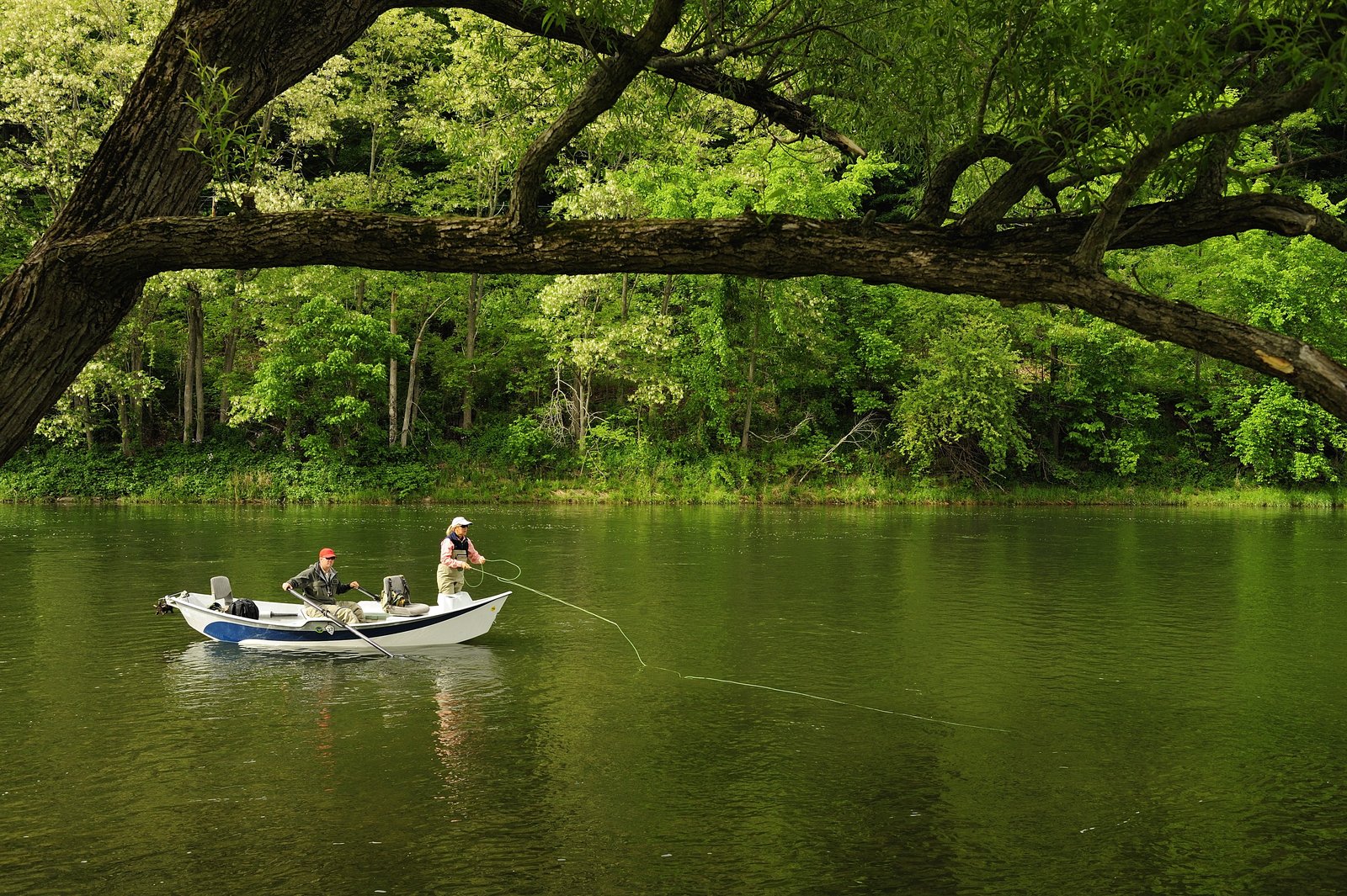 A guide working with a client on the water, photographed by The Delaware River Club in PA