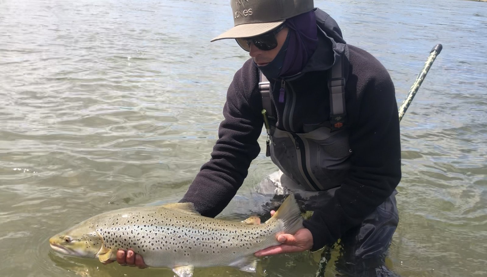 A guide working with a client on the water, photographed by The Lodge at Palisades Creek in ID