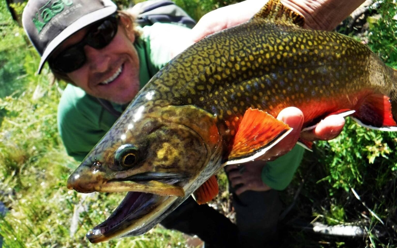 A guide working with a client on the water, photographed by The Quiet Fly Fisher in UT