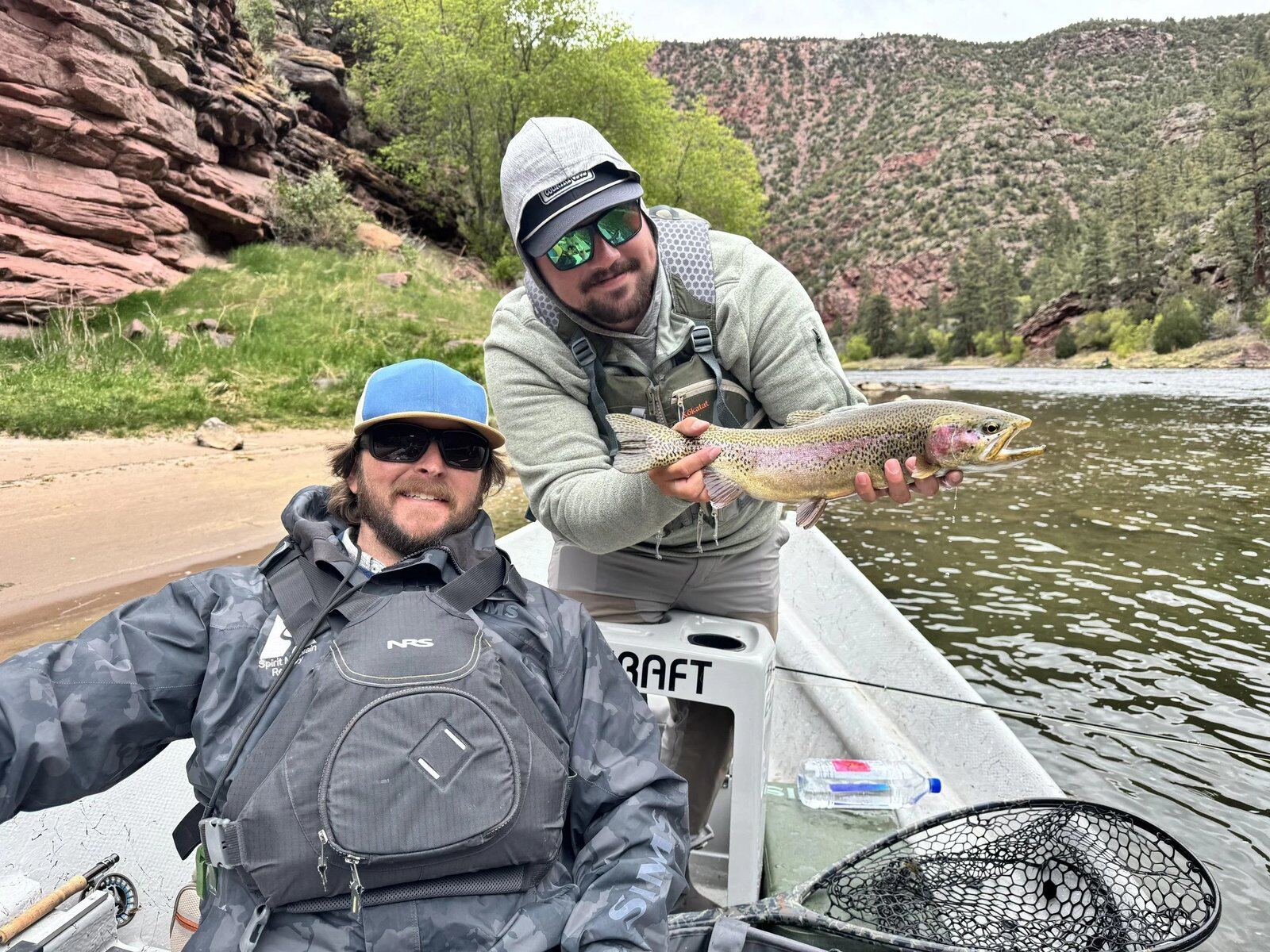 A guide at work during a trip, photographed by Trutta Co Fly Fishing in UT