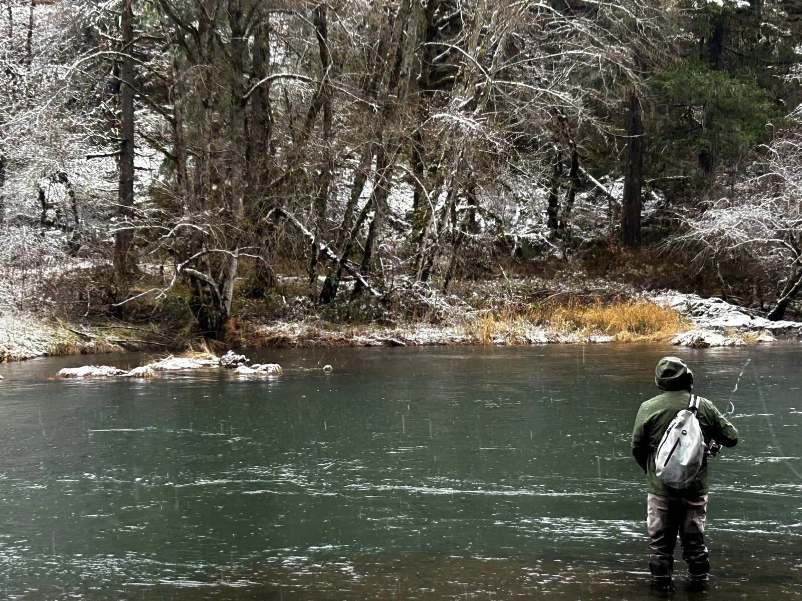 A guide working with a client on the water, photographed by Willamette Valley Fishing Guides in OR
