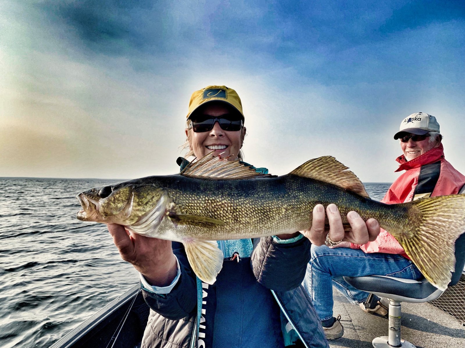A guide working with a client on the water, photographed by Wings and Walleyes Guide Service in MN